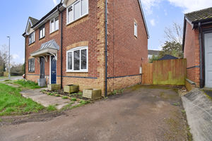 Side elevation and parking area- click for photo gallery